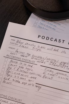 Detailed podcast planning sheet with handwritten notes for effective recording.